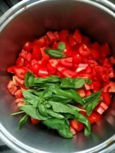 Tomatoes with basil Homemade salsa recipe tomato sauce how to make process of making homemade tomato sauce